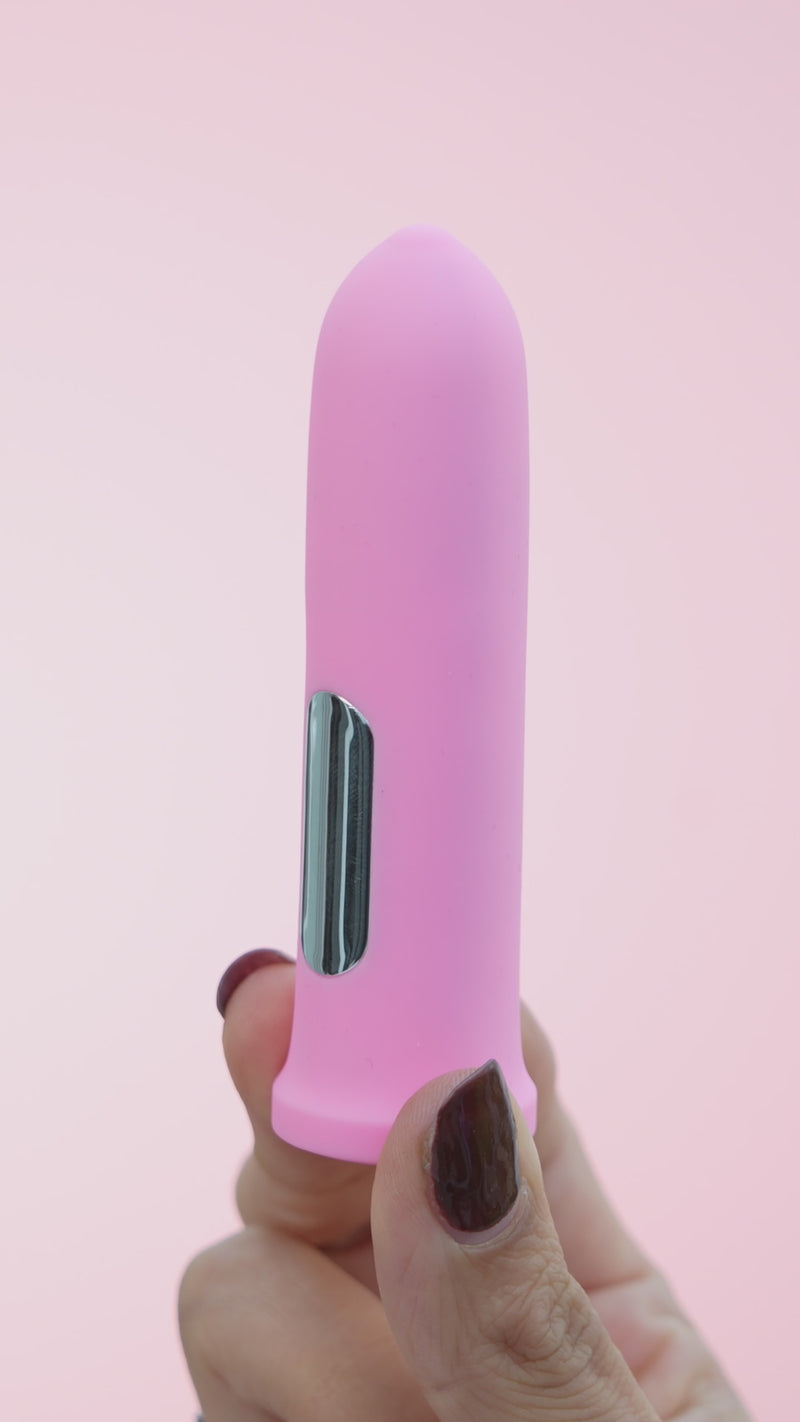 bullet vibrator female adult sex toy in pink and purple. 